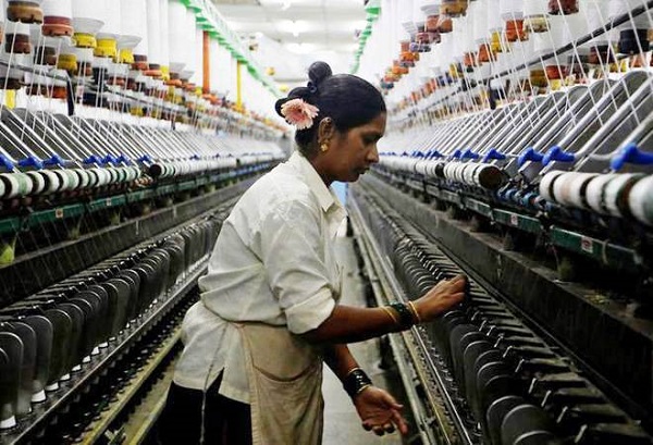 A Lady Worker in An Industry Checking The Working Process Of The Machinery.